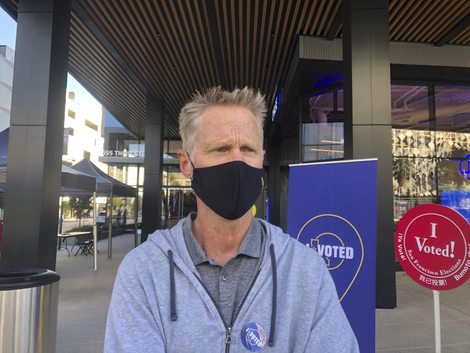 Golden State Warriors coach Steve Kerr discusses the voting process at the Chase Center drop-off location on Saturday, Oct. 31, 2020. (AP Photo/Janie McCauley)