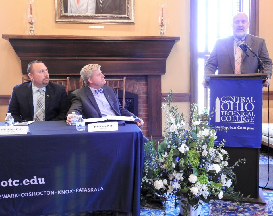 Eric Heiser, provost for COTC, and John Berry, president of COTC, listen to Matt Colvin, superintendent of the Coshocton County Career Center, speak at a press conference regarding what COTC will offer students regarding skills and degrees to get jobs with the Intel chip plant coming to Licking County. This includes working with vocational schools and public school districts to build a pipeline of workers.