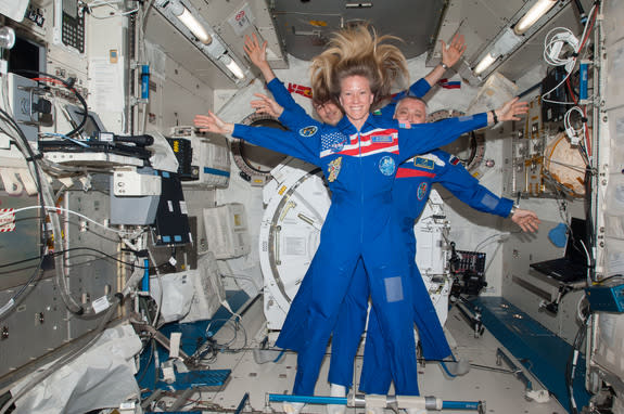 NASA astronaut Karen Nyberg, flight engineer; Russian cosmonaut Fyodor Yurchikhin (center), commander; and European Space Agency astronaut Luca Parmitano, flight engineer, echo Leonardo Da Vinci's famed 'Vitruvian Man' in a crew photo on the In