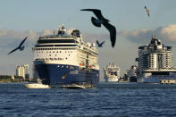 The Celebrity Summit cruise ship prepares to depart from PortMiami, Saturday, Nov. 27, 2021, in Miami. Cooped-up tourists eager for a taste of Florida's sandy beaches, swaying palm trees and warmer climates are visiting the Sunshine State in droves, topping pre-pandemic levels in recent months. (AP Photo/Lynne Sladky)