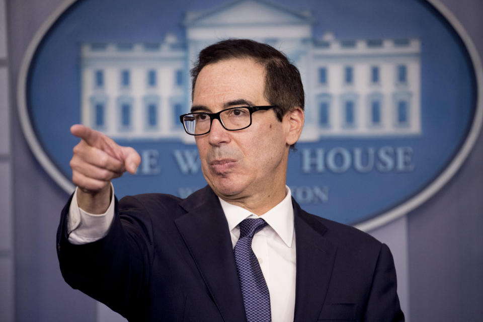 Treasury Secretary Steven Mnuchin takes a question from a reporter after announcing the threat of sanctions on Turkey in the Briefing Room of the White House in Washington, Friday, Oct. 11, 2019. The White House is putting Turkey on notice that it could face new "powerful sanctions" and the US. will "shut down the Turkish economy" if Ankara goes too far in its incursion against the Kurds in northern Syria. (AP Photo/Andrew Harnik)