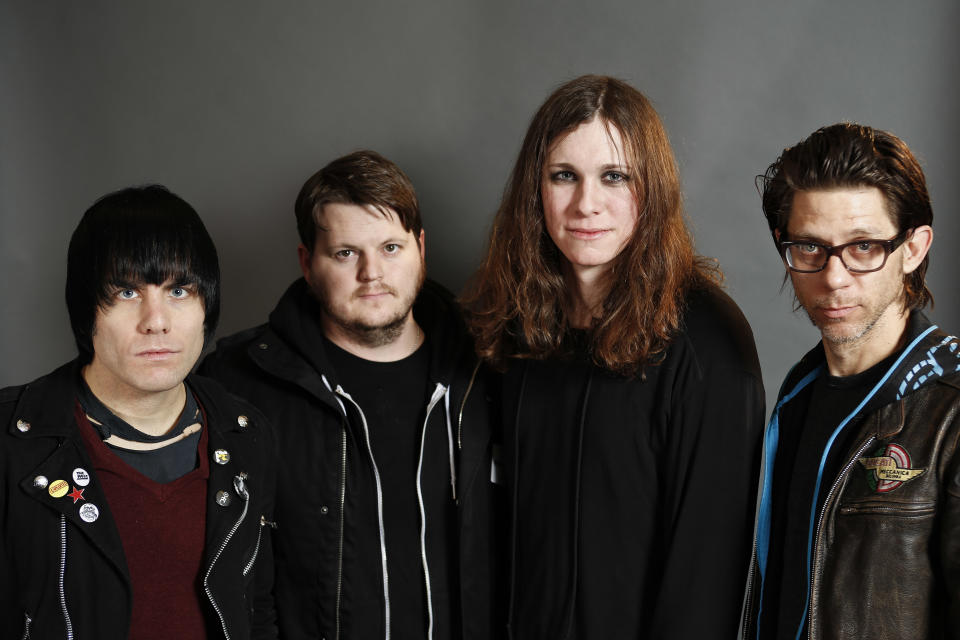 This Jan. 10, 2014 photo shows members of the band Against Me!, from left, Inge Johansson, James Bowman, Laura Jane Grace, formerly known as Tom Gabel, and Atom Willard in New York. Grace, 33, publicly came out as transgender in 2012. She was born Tom Gabel and performed with the Florida-based band since 1997. The group’s latest album, “Transgender Dysphoria Blues,” a concept record about a transgender prostitute, marked a chart high for the band when it reached No. 23 on the Billboard 200 albums chart in late January. (Photo by Brian Ach/Invision/AP)