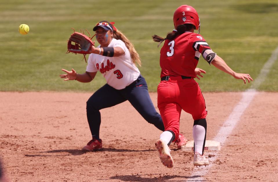 Utah’s Haley Denning, battles to beat the throw and is just short as Ole Miss’ Keila Kamoku, reaches to make the catch as the University of Utah softball team plays Ole Miss in NCAA softball regional championship at Utah in Salt Lake City on Sunday, May 21, 2023. Utah won 4-1. | Scott G Winterton, Deseret News