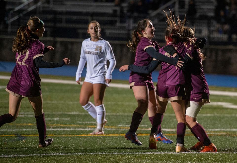 Algonquin Regional High School's Shaila Seghal (#15) swarmed by teammates after scoring the winning goal in the Central Mass Athletic Directors Association Class A girls soccer championship, defeating Shrewsbury, 1-0, at the Assabet Valley Regional High School field, Nov. 1, 2023.