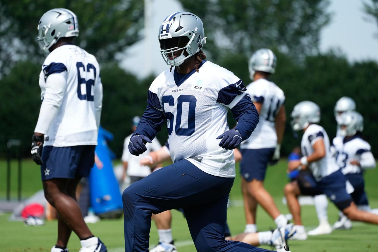 Dallas Cowboys tackle Tyler Guyton (60) goes through a drill during practice June 5 at the Star Training Facility in Frisco, Texas.