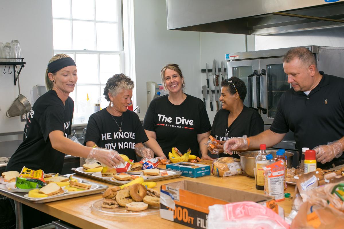 Difference Makers Kristy Crill of The Dive Savannah feeds hungry