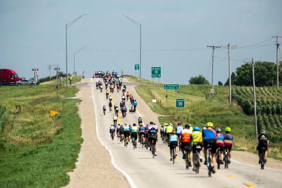 Riders make their way up a hill during the fourth day of RAGBRAI in 2022.