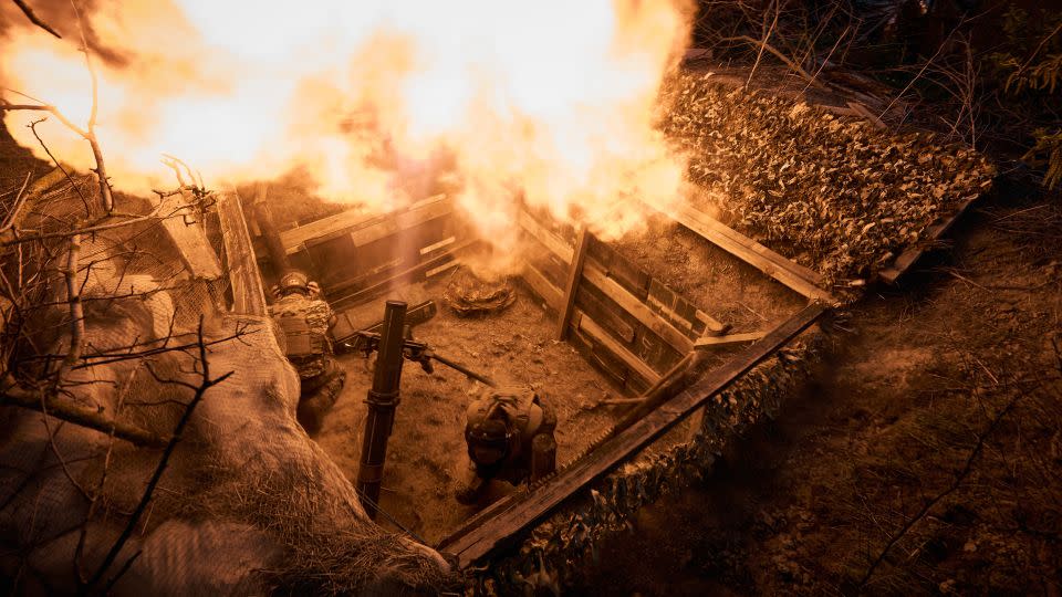 Ukrainian soldiers fire a 120 mm mortar on April 19, 2024. - Kostiantyn Liberov/Libkos/Getty Images