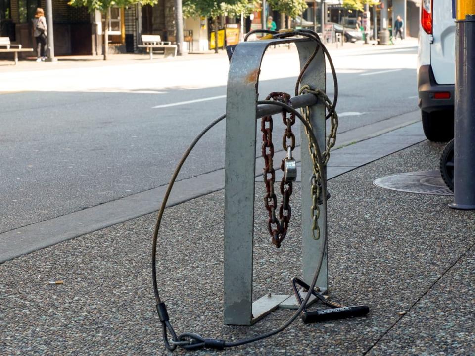 Broken locks left without bikes on Granville Street — a symbol of the bike theft problem in Vancouver. Bicycle theft is a problem everywhere and in Fredericton it has been on the rise since 2016, police statistics show. (Tina Lovgreen/CBC - image credit)