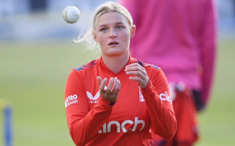 Ryana MacDonald-Gay tosses a ball to herself as she prepares to bowl