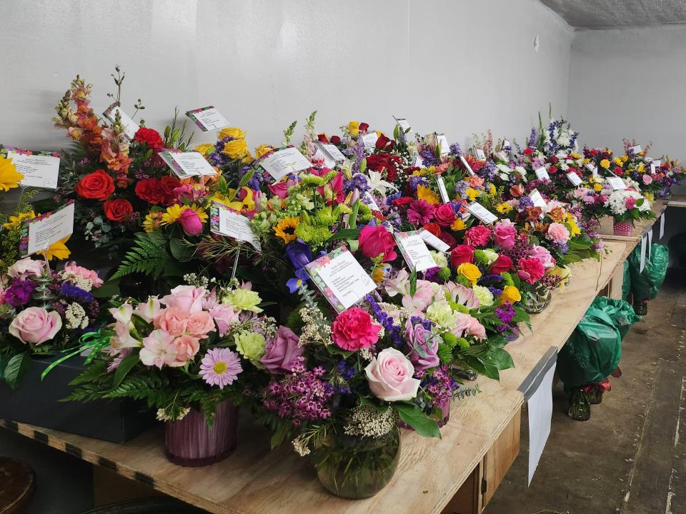 Scott's Flowers organizes rooms full of arrangements to be delivered during the week of Mother's Day.