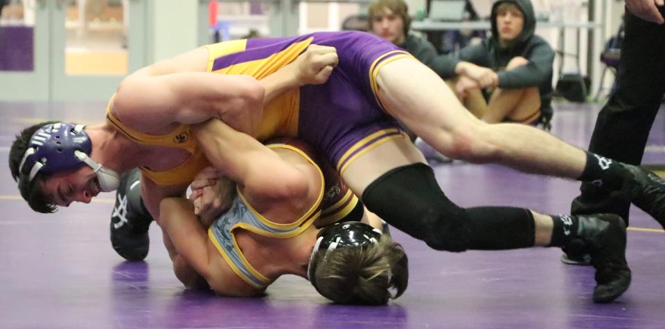 Watertown's Connor Hanson turns Harrisburg's Tayge Privett during their 126-pound match Saturday in the Marv Sherrill Dual Wrestling Tournament in the Civic Arena.