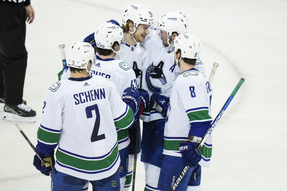 Vancouver Canucks' Vasily Podkolzin (92) celebrates with teammates after scoring a goal during the second period of an NHL hockey game against the New York Rangers Wednesday, Feb. 8, 2023, in New York. (AP Photo/Frank Franklin II)