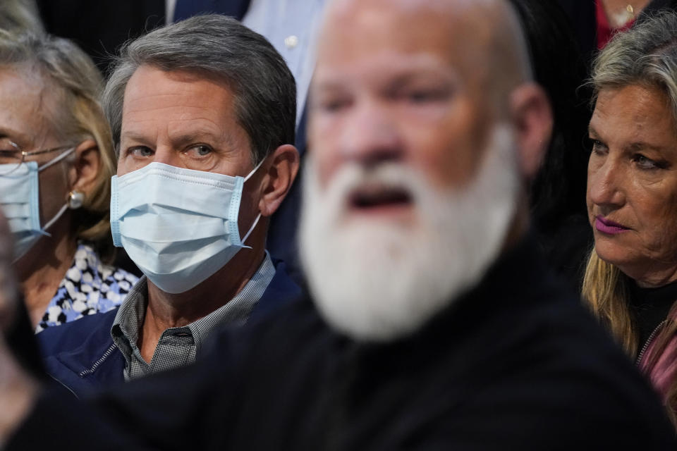 Georgia Gov. Brian Kemp listens during a news conference at the State Capitol on Saturday, April 3, 2021, in Atlanta, about Major League Baseball's decision to pull the 2021 All-Star Game from Atlanta over the league's objection to a new Georgia voting law. (AP Photo/Brynn Anderson)