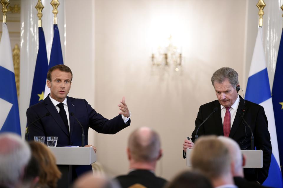 French President Emmanuel Macron, left, and Finland President Sauli Niinisto attend their joint press conference Presidential Palace in Helsinki, Finland, Thursday Aug. 30, 2018. President Macron is in Finland on a two-day official visit. (Antti Aimo-Koivisto/Lehtikuva via AP)