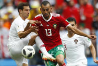 <p>Portugal’s Cedric, left, challenges Morocco’s Khalid Boutaib </p>
