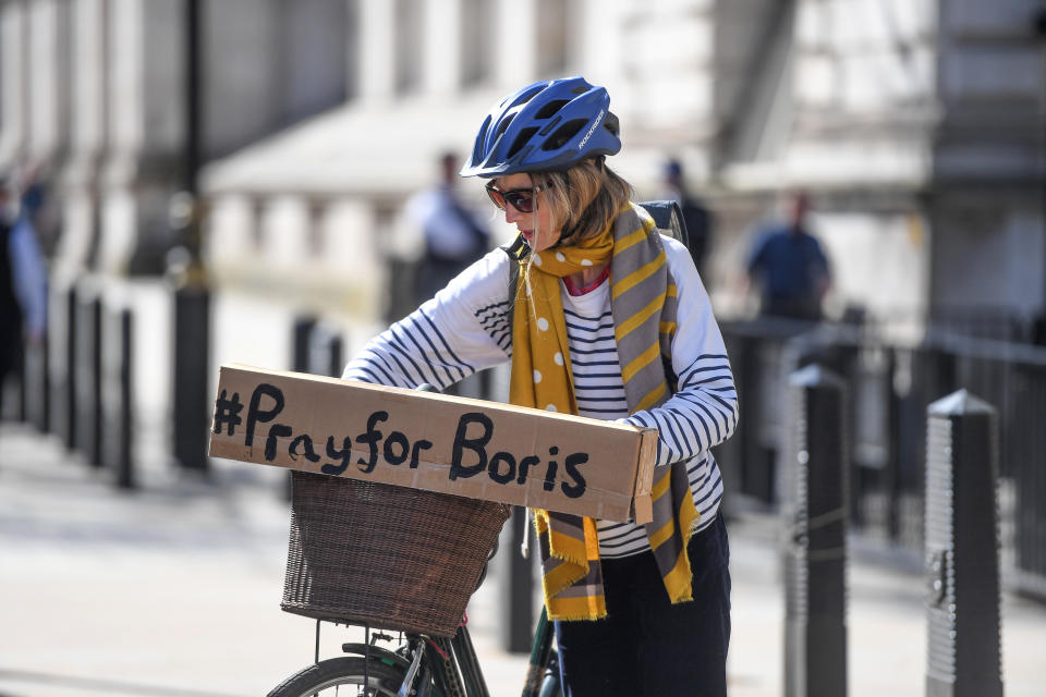 LONDON, ENGLAND - APRIL 07: A cyclist with a sign reading '#PrayforBoris' rides through Westminster on April 7, 2020 in London, England. Prime Minister Boris Johnson was transferred to the intensive care unit at St Thomas' Hospital after his coronavirus symptoms worsened last night. (Photo by Peter Summers/Getty Images)