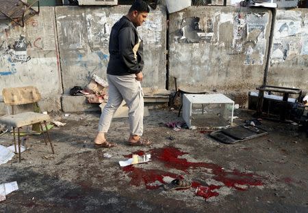 A man walks at the site of suicide blasts in Baghdad's Sadr City Iraq February 28, 2016. REUTERS/Wissm al-Okili