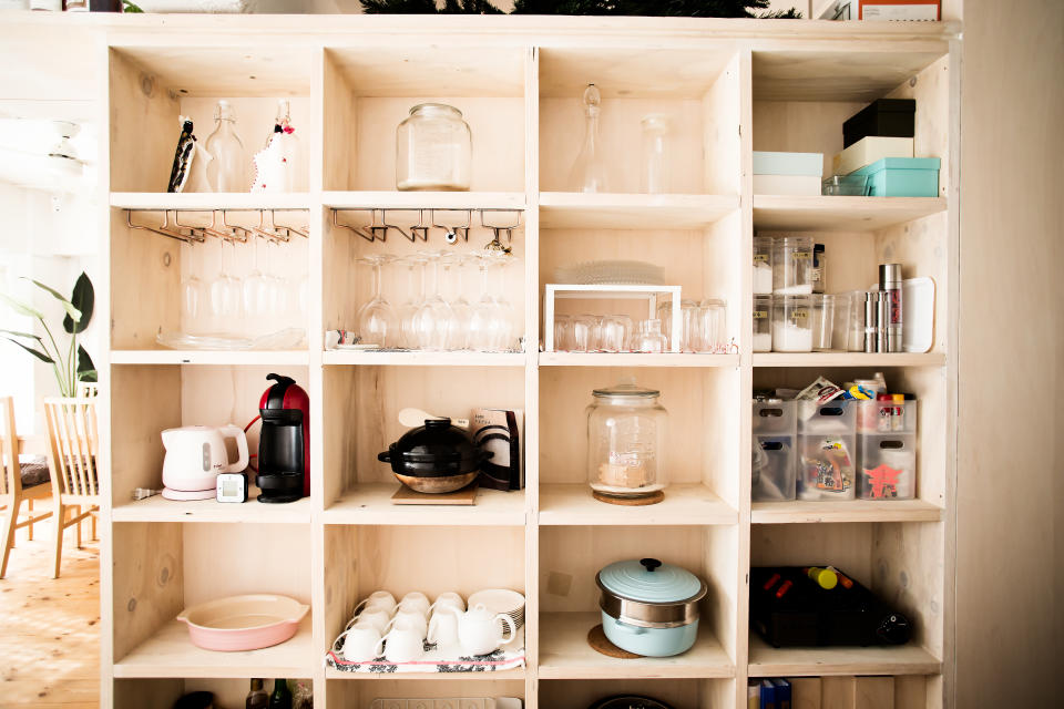 Using shelving to cover the entirety of single wall can allow you to create a very functional wall in a small space that facilitates storage, work, and provides a visually interesting display says expert Cameron Johnson. Photo: Getty