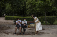 A group of women gather at the Retiro park in Madrid, Spain, Monday, June 1, 2020. Spain on Monday reported no official deaths from the new coronavirus in a 24-hour period for the first time since March. Spain was the second European country after Italy to be forcefully hit by the pandemic before it also spread death in France and Britain. One of the world's strictest lockdowns was put into place in mid-March and managed to eventually reduce the pressure on hospitals after some were overwhelmed with patients suffering from the virus. (AP Photo/Bernat Armangue)