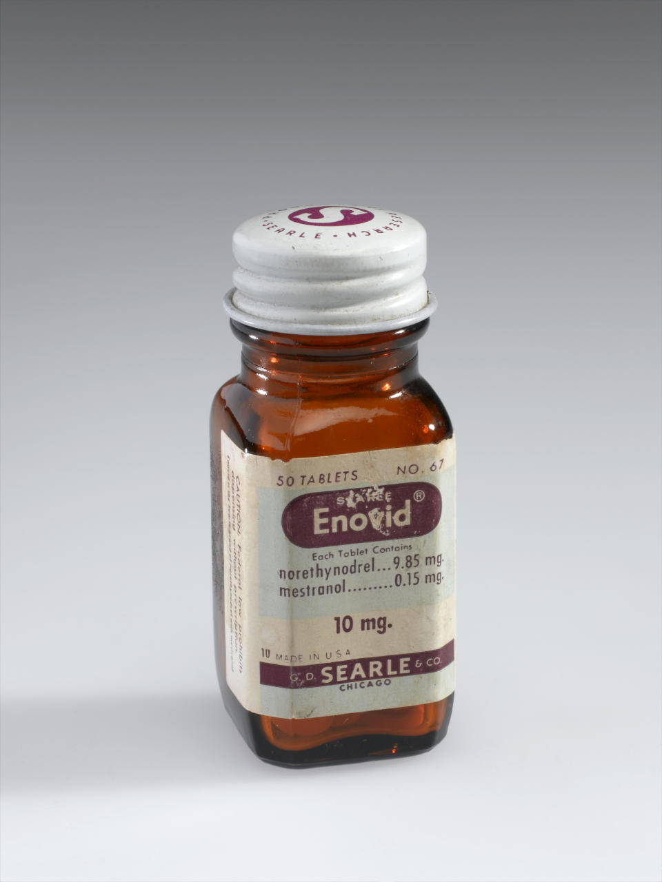 UNITED KINGDOM - JANUARY 25:  Bottle of Enovid tabs 10mg, early 1960s. Front three quarter view. Graduated grey background.  (Photo by Science Museum/SSPL/Getty Images)