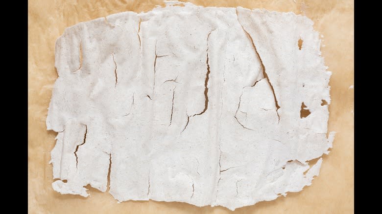 Dried sourdough starter on parchment