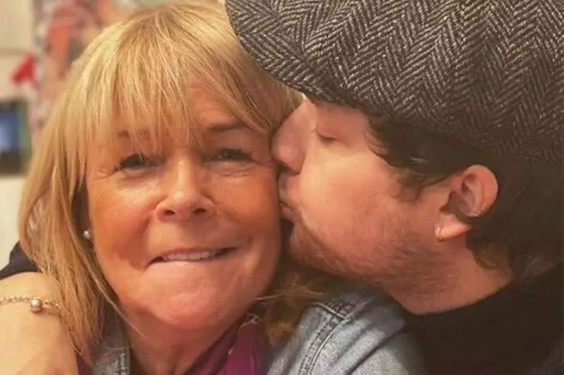 Linda Robson's son Louis Dunford kisses her on the cheek