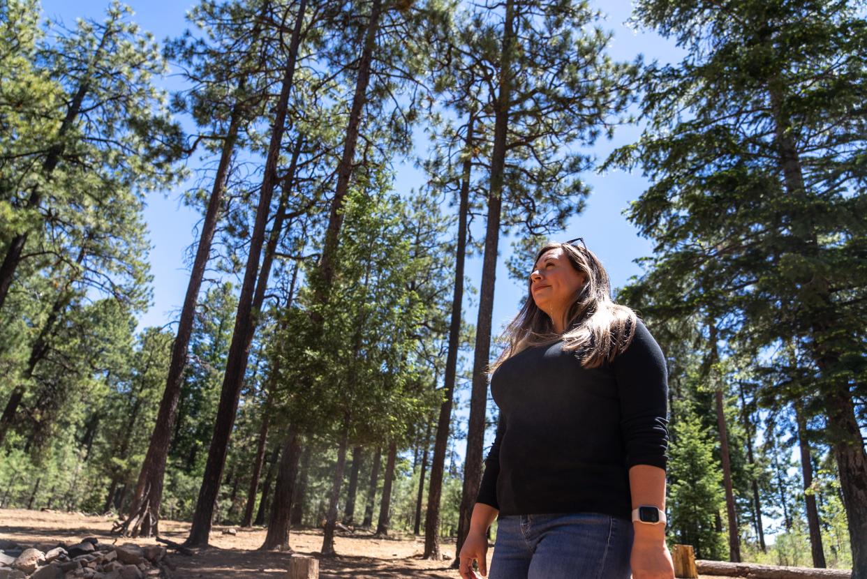 Elvy Barton, Salt River Project forest health management principal, walks near Baker Butte on May 16, 2022.