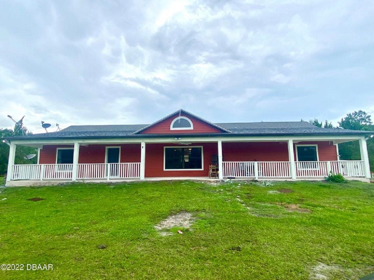 This 10-acre Osteen property is zoned agricultural and holds the main home, a 1,500-square-foot red-metal barn, a 3,000-square-foot greenhouse, a Conex container for storage and a large pond stocked with fish and turtles.