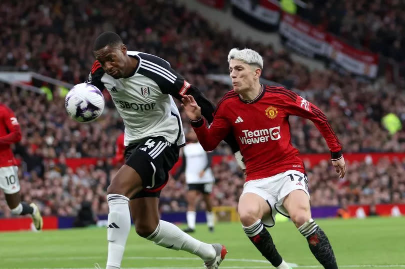 Tosin Adarabioyo attempts to shield the ball from Manchester United forward Alejandro Garnacho.