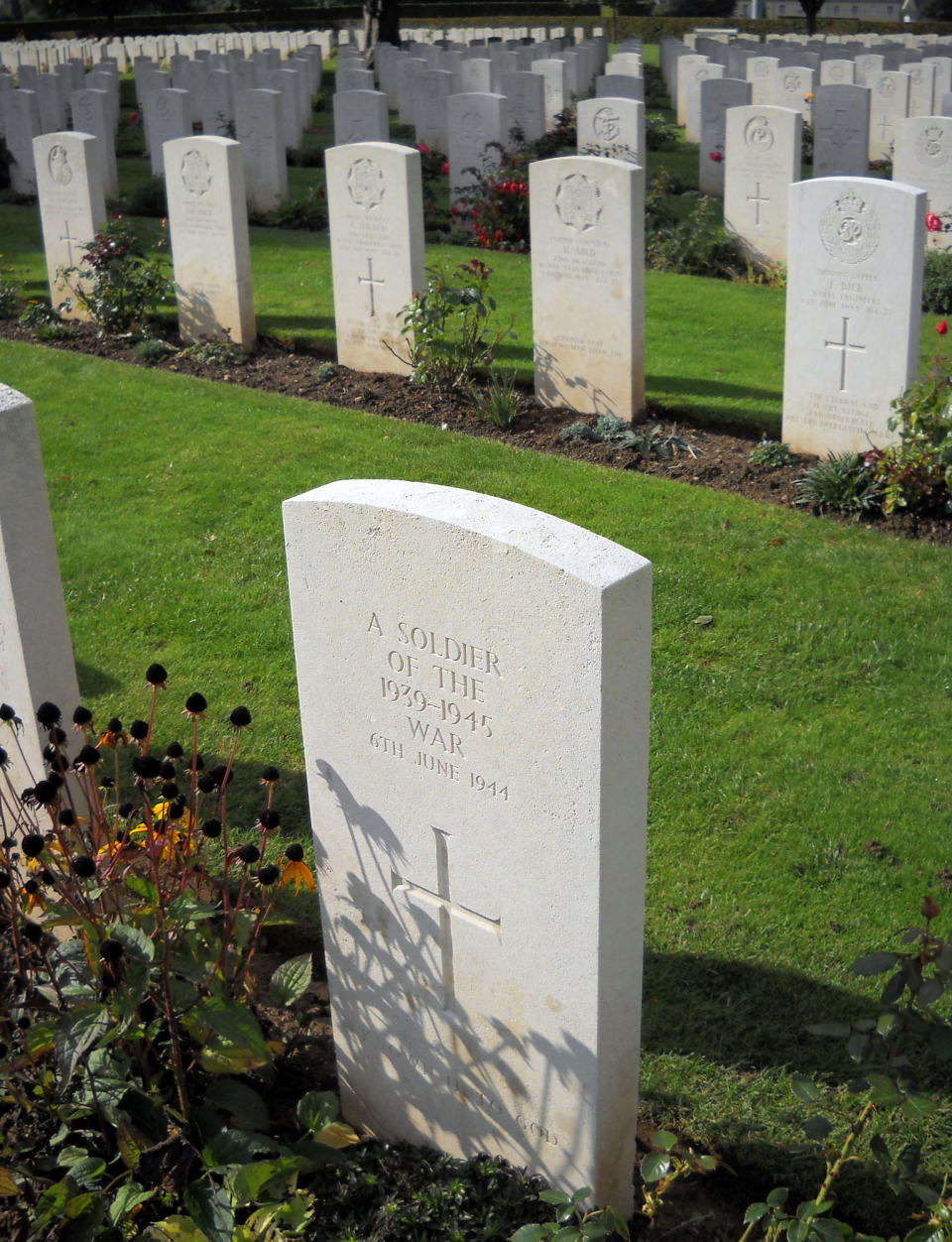 This Oct. 12, 2013 photo shows the graves of British soldiers killed on D-Day and during the ensuing battles of World War II occupy a cemetery in Bayeux, France. Bayeux sits just a few miles from the beaches of Normandy where Allied forces invaded in 1944. (AP Photo/Kathy Matheson)