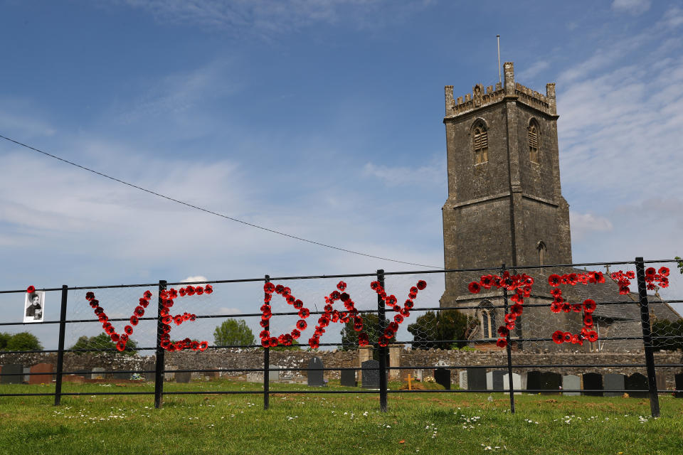 BINEGAR, ENGLAND - MAY 08: A portrait of Robinson Collins is displayed outside Holy Trinity Church to commemorate VE Day on May 08, 2020 in Binegar, Somerset, United Kingdom. The UK commemorates the 75th Anniversary of Victory in Europe Day (VE Day) with a pared-back rota of events due to the coronavirus lockdown. On May 8th, 1945 the Allied Forces of World War II celebrated the formal acceptance of surrender of Nazi Germany. (Photo by Michael Steele/Getty Images)