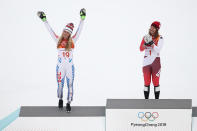 <p>Silver medalist, Mikaela Shiffrin of the United States (L) celebrates with gold medalist, Michelle Gisin of Switzerland (C) on the podium during the Ladies’ Alpine Combined on day thirteen of the PyeongChang 2018 Winter Olympic Games at Yongpyong Alpine Centre on February 22, 2018 in Pyeongchang-gun, South Korea. (Photo by Ezra Shaw/Getty Images) </p>