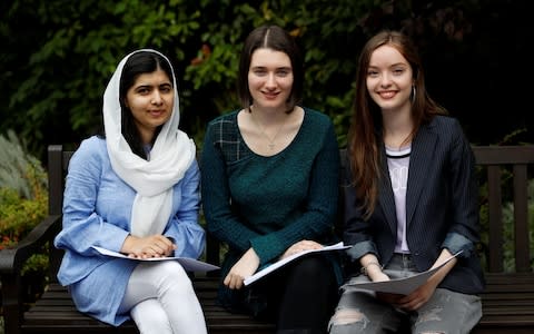 Malala Yousefzai poses with fellow students Bethany Lucas and Beatrice Kessedjian - Credit: Darren Staples/Reuters