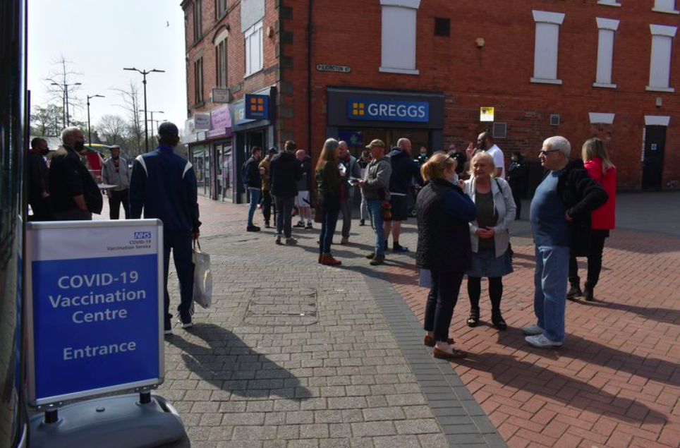 Anti-vaxxers shared leaflets with people gathered outside a COVID vaccine bus at Bulwell market in Nottingham. (Reach)