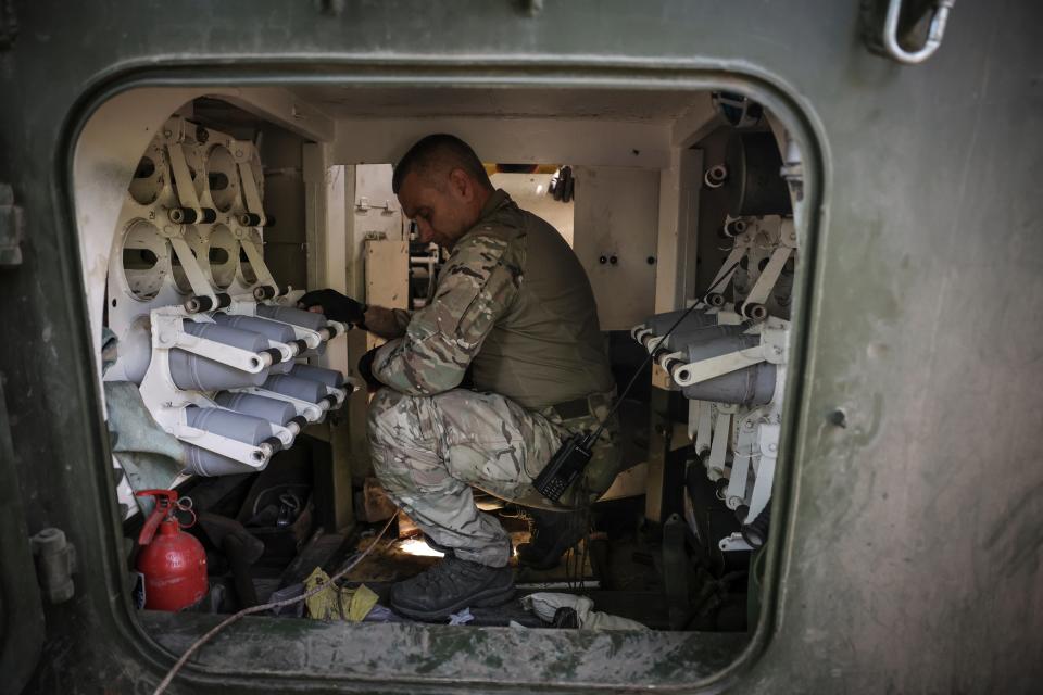 A serviceman prepares to fire a “Gvozdika” 120mm Soviet-made howitzer towards Russian positions at outskirts of Chasiv Yar, Donetsk region, Ukraine (AP)