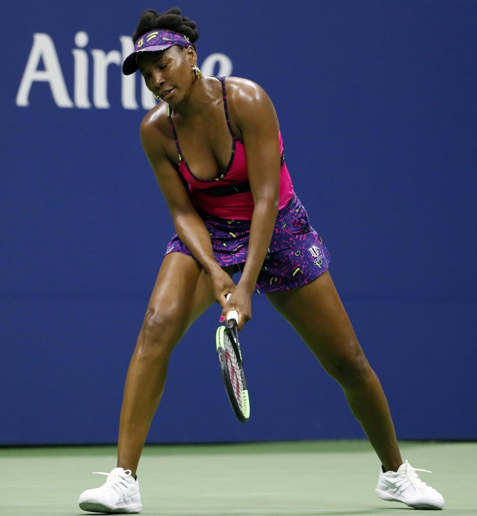 Venus Williams reacts to losing a point against Serena Williams during the third round of the U.S. Open tennis tournament Friday, Aug. 31, 2018, in New York. Serena Williams won 6-1, 6-2. (AP Photo/Adam Hunger)