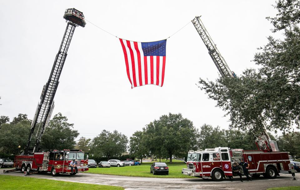 Marion County Fire Rescue hung a huge American Flag between two ladder trucks at the annual Veterans Day celebration at the Veterans Memorial Park in 2020.