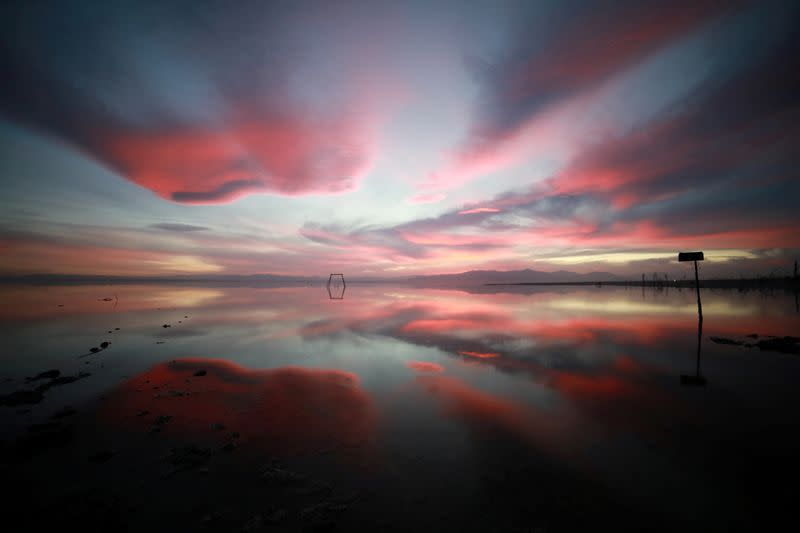 FILE PHOTO: Sunset is reflected in the Salton Sea as seen from Bombay Beach