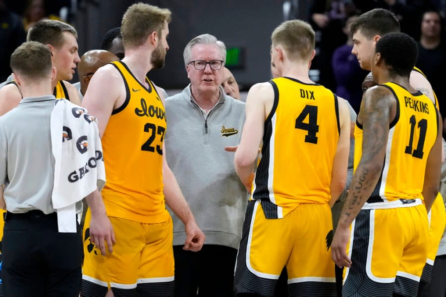 Iowa coach Fran McCaffery, center, talks to players during the second half of an NCAA college basketball game against Northwestern in Evanston, Ill., Saturday, March 2, 2024. (AP Photo/Nam Y. Huh)