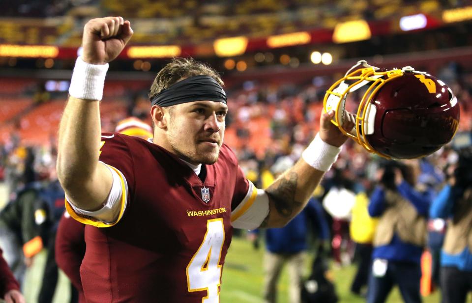 Washington Football Team quarterback Taylor Heinicke (4) celebrates after an NFL football game against the Seattle Seahawks, Monday, Nov. 29, 2021 in Landover.