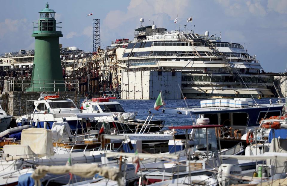 The cruise liner Costa Concordia is seen in front of at Giglio harbour, Giglio Island July 13, 2014. (REUTERS/Alessandro Bianchi)