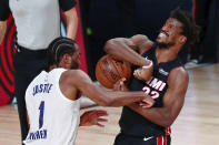 Indiana Pacers forward T.J. Warren (1) defends against Miami Heat forward Jimmy Butler (22) during the second half of Game 3 of an NBA basketball first-round playoff series, Saturday, Aug. 22, 2020, in Lake Buena Vista, Fla. (Kim Klement/Pool Photo via AP)