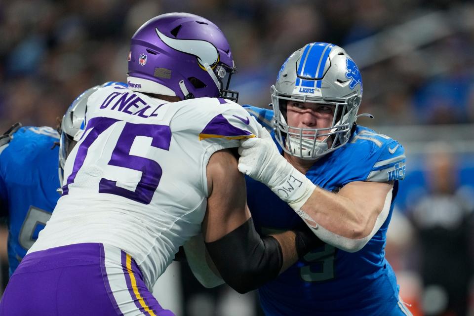 Detroit Lions defensive end John Cominsky (79) rushes against Minnesota Vikings offensive tackle Brian O'Neill (75) Dec. 11, 2022, in Detroit.