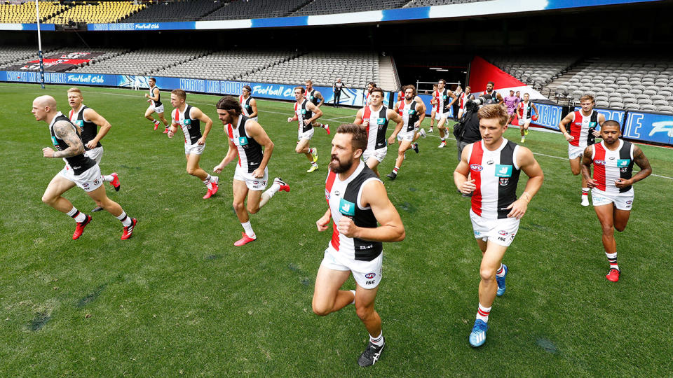 Pictured here, St Kilda players run out for their round one AFL match.