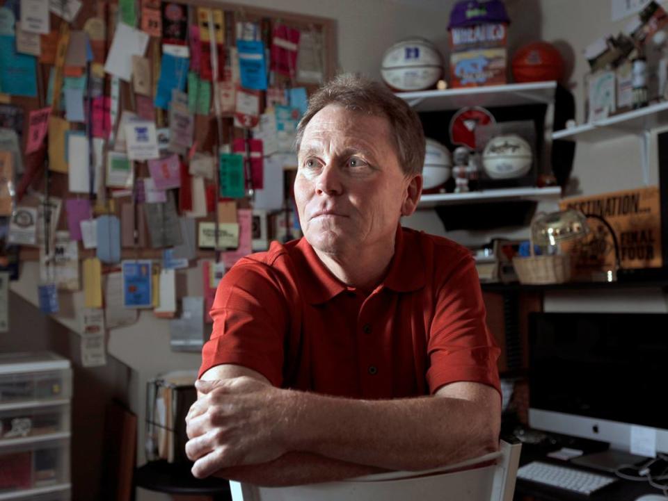 In this 2011 file photo, former WTVD sports reporter Tony Debo poses in his home “sports office” where the walls are adorned with sports memorabilia from events he covered over the years.