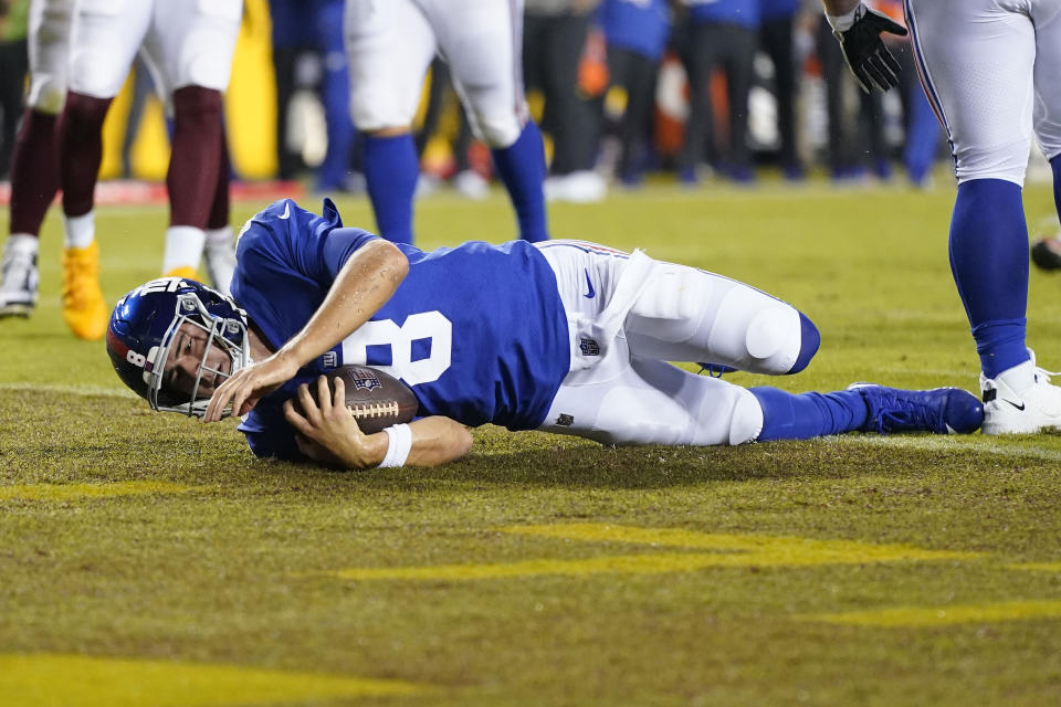 New York Giants quarterback Daniel Jones (8) scoring a touchdown against the Washington Football Team during the first half of an NFL football game, Thursday, Sept. 16, 2021, in Landover, Md. (AP Photo/Patrick Semansky)