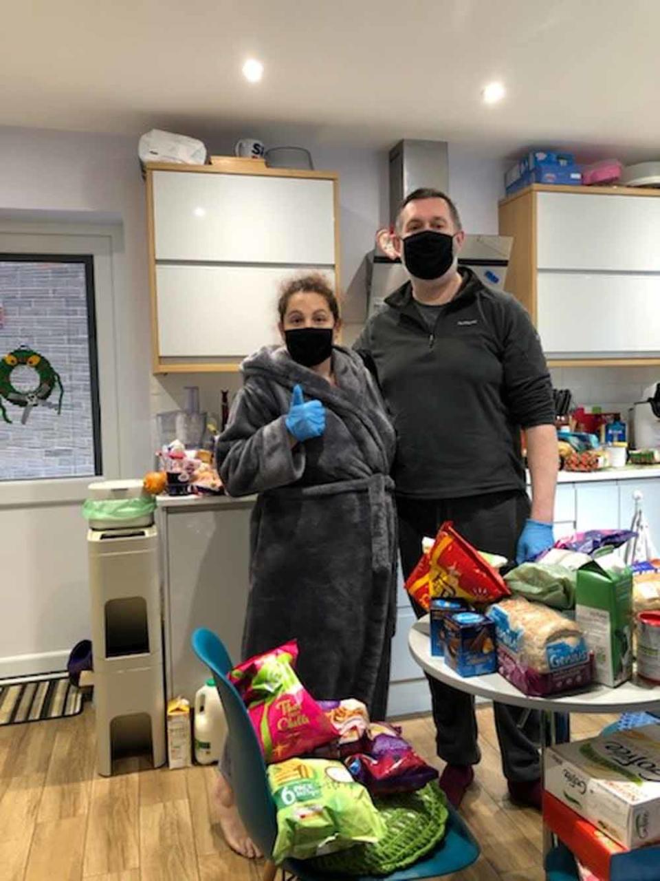 Fiona and Steve, pictured here after their time in quarantine, with their 2020 Christmas shop delivery. (Collect/PA Real Life)