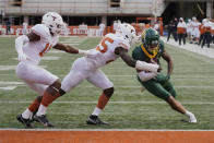 FILE - Baylor's Gavin Holmes (6) runs past Texas' B.J. Foster (25) and Anthony Cook (11) for a touchdown during the second half of an NCAA college football game in Austin, Texas, Saturday, Oct. 24, 2020. Baylor is set to kick off its season on Sept. 3, 2022, against Albany. (AP Photo/Chuck Burton, File)