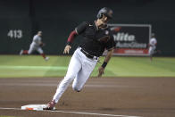 Arizona Diamondbacks Pavin Smith rounds third on the way to scoring against the Washington Nationals during the first inning during a baseball game Saturday, May 15, 2021, in Phoenix. (AP Photo/Rick Scuteri)